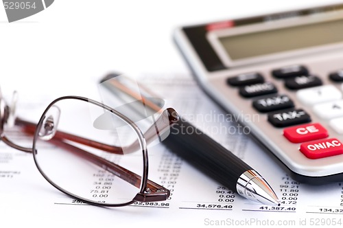 Image of Tax calculator pen and glasses