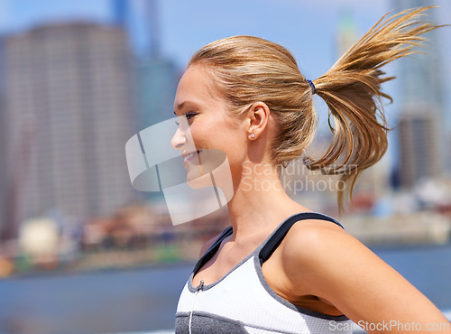 Image of Woman, happy and running for fitness in city, jogging active and fit female person exercising in New York. Energy, marathon for sports training and workout for athlete, cardio wellness and endurance