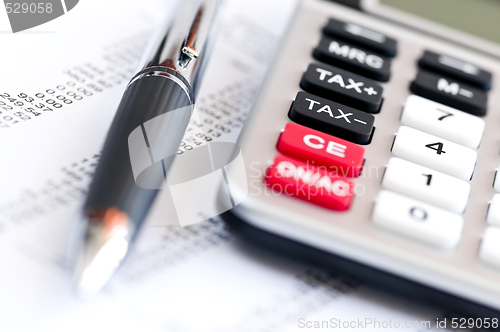 Image of Tax calculator and pen