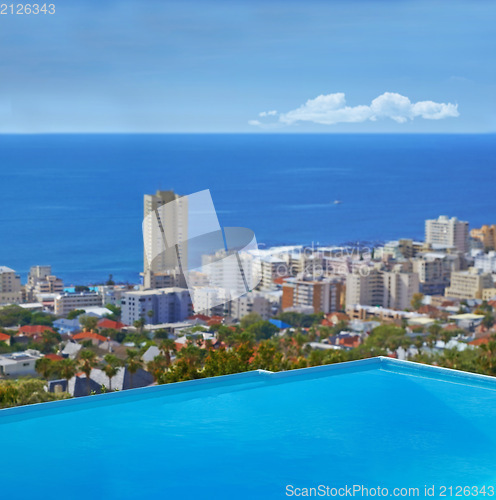 Image of Swimming pool, city and building or ocean outdoor at travel destination in summer for hotel, infrastructure or downtown. Skyline, water and lodge accommodation in Cape Town or relax, trip or vacation