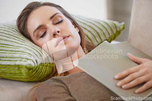 Image of Woman, book and sofa sleeping in home for weekend nap in living room for wellness, holiday vacation or calm. Female person, magazine and comfortable or tired in apartment for casual, peace or resting