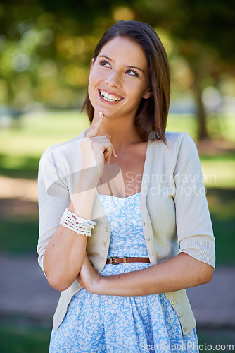 Image of Happy woman, nature and thinking of outdoor fashion with travel, confidence and summer clothes. Young and casual person in floral dress with smile, inspiration and ideas for style in a park or garden