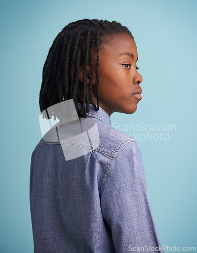 Image of Thinking, idea and black boy kid in studio with why, questions or memory on blue background. Planning, child development and African teen model with vision for solution, problem solving or reflection