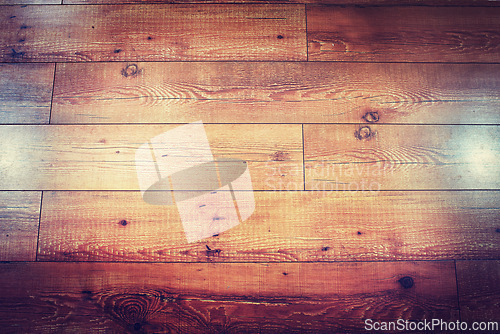 Image of Texture, laminated and closeup of wooden floor at house in room for vintage interior design. Luxury, retro and zoom of brown natural timber ground with classic textile in modern home or apartment.