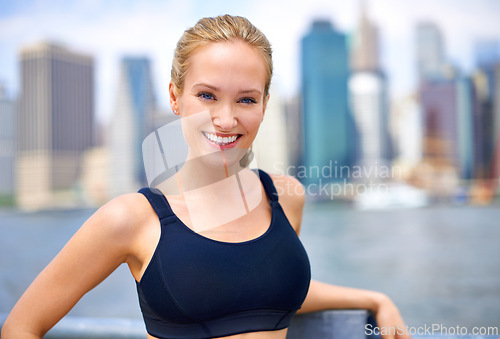 Image of Woman, portrait and confident in city for workout morning routine, wellness and fitness for active cardio. Female person, happy and runner or athlete for sports hobby or training exercise in New York