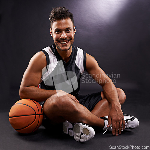 Image of Man, portrait and basketball player with smile for sports performance, competition or black background. Male person, face and healthy wellness with pride for training workout, studio or mockup space