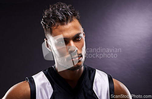 Image of Man, athlete and thinking confidence for exercise as basketball player or professional, pride or black background. Male person, thoughts and workout training or sport game, fitness or mockup space