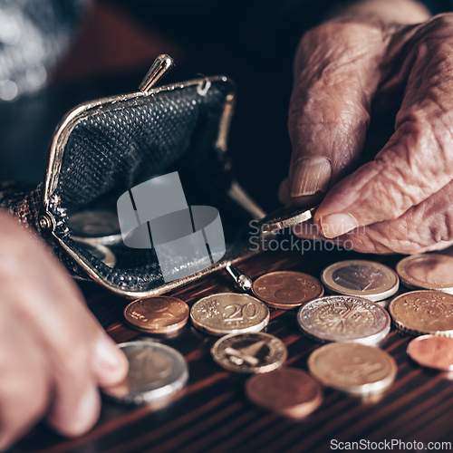 Image of Detailed closeup photo of elderly 96 years old womans hands counting remaining coins from pension in her wallet after paying bills. Unsustainability of social transfers and pension system.