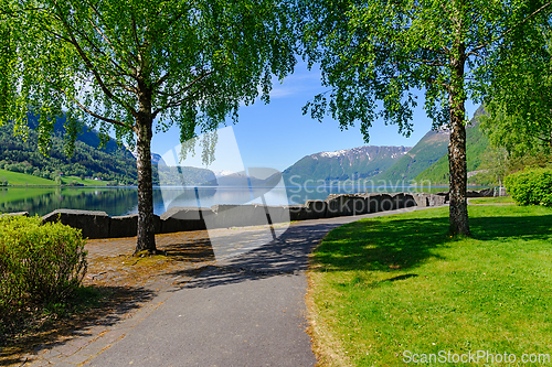 Image of Serene morning walk by the lakeside in beautiful norwegian fjord