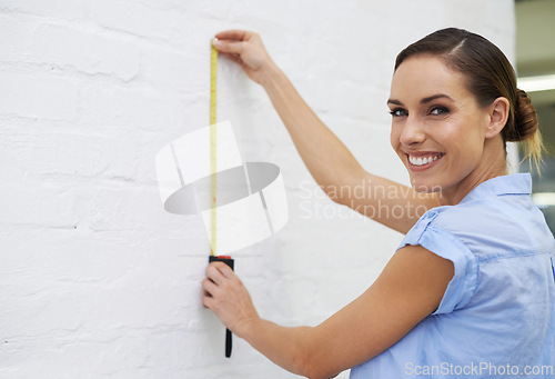 Image of Measure tape, wall and portrait of woman in house for interior design or renovation project and tools to upgrade. Female person, remodeling and diy for home improvement or development and creative.