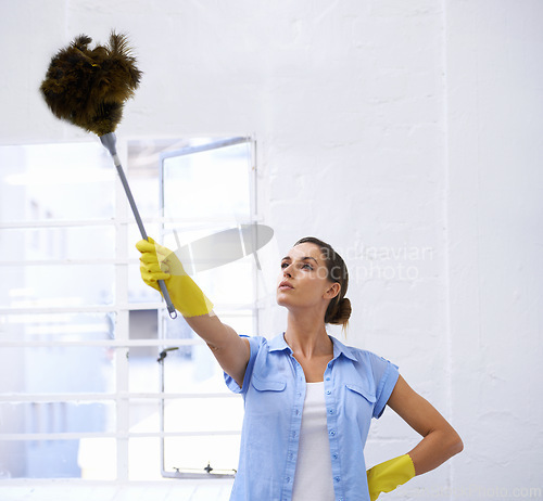 Image of Woman, cleaning and duster for housekeeping in home, feather and worker for sanitation or disinfection. Female person, supplies and maid for sterilization, equipment and rubber gloves for hygiene