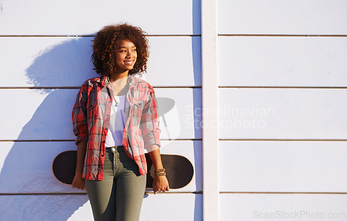 Image of Skateboard, fashion and black woman in skatepark for exercise, training and skating in city. Skater, smile and happy female person for trendy, edgy style and hipster clothing in San Francisco