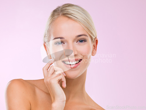 Image of Woman, portrait and skincare beauty in studio for healthy treatment, pink background or confidence. Female person, face and hand for makeup cosmetics or dermatology wellness, facial or mockup space