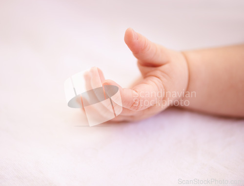 Image of Fingers, hands and rest with closeup baby, tired kid on duvet for relaxing comfort in nursery. Child development, peaceful infant or newborn toddler, wellness and calm in bedroom of family home