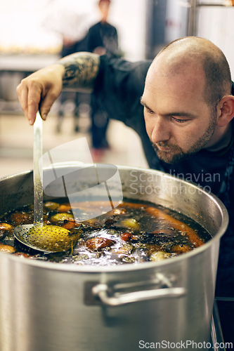 Image of Chef tasting soup