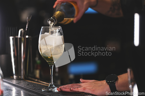 Image of Bartender pouring cocktail