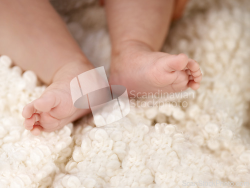 Image of Feet, comfort and rest for sleeping baby, tired or peaceful kid and nurture in blanket for relaxing in nursery. Child development, barefoot newborn or health, childcare and family home with growth
