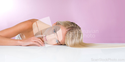 Image of Studio, portrait and beauty of woman with skincare for health, glow and shine of skin of girl. Pink background, adult and female person with soft, face and results from dermatology and cosmetics