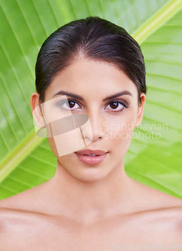 Image of Skin, woman and beauty with palm leaf background, makeup and natural skincare with dermatology. Organic, nature and eco friendly cosmetics in portrait, clean with wellness and sustainable treatment