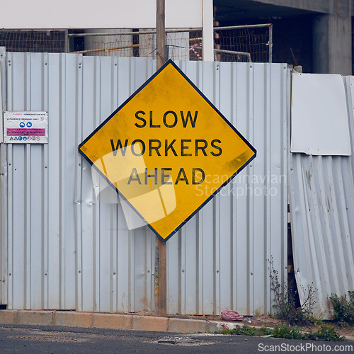 Image of Road sign, warning and signage in street for construction with caution notification and yellow triangle outdoor. Attention, public notice and signpost for roadworks, alert message and symbol in city