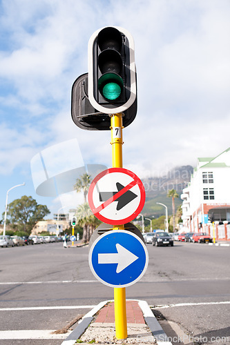 Image of Road sign, traffic light and signage in street for direction with attention notification and arrow symbol outdoor in city. Board, public notice and signpost for route, alert message and advertisement