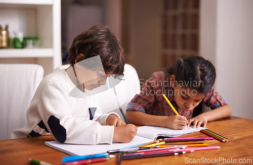 Image of Education, remote learning and siblings in a kitchen with book, writing or homework assignment in their home. Notebook, homeschool and children studying in a house with help, support or art lesson