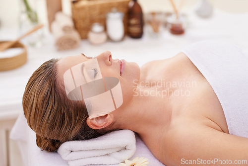 Image of Woman, face and top view with eyes closed at spa, massage and wellness with calm for zen and self care. Cosmetics, beauty and holistic healing, relax and peace at luxury resort with treatment