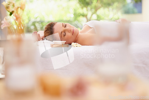 Image of Woman, relax and sleeping with towel at spa in stress relief, zen or health and wellness on massage table. Calm female person enjoying luxury skincare, body treatment or relaxation at peaceful resort