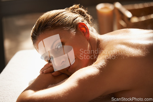 Image of Happy woman, back and relax with massage for spa, zen or body treatment at hotel, resort or indoor salon. Face of female person in relaxation for peaceful holiday, stress relief or physical therapy