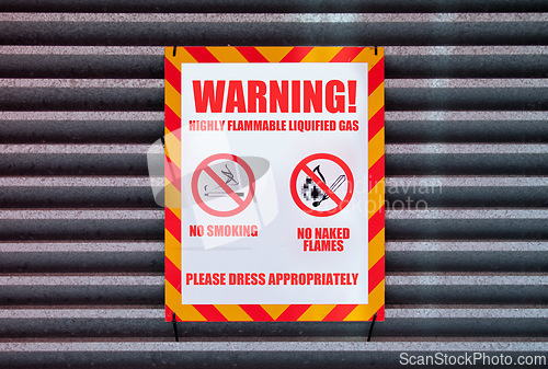 Image of Poster, warning and signage on board for sign with caution notification or red square on garage by building. Attention, public message and signpost for no smoking, comic signal and symbol for humor