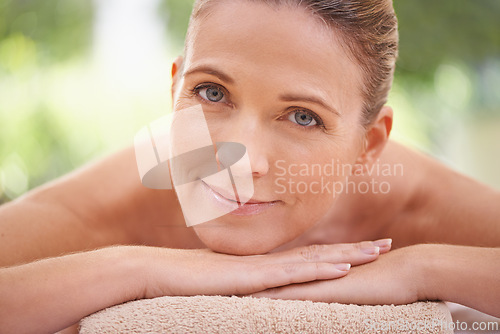 Image of Closeup, portrait or woman in skincare, beauty or glow of flawless skin, spa or peace in wellness. Girl, smile or lying on massage, table or towel in mental health, cosmetology or self care at clinic