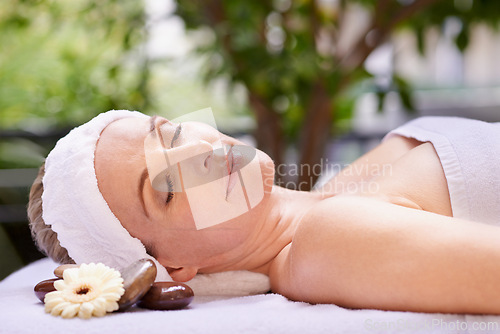 Image of Happy woman, sleeping and relaxation with zen for skincare, stress relief or peace at spa, hotel or resort. Calm female person asleep in relax for facial, beauty or body treatment at outdoor salon