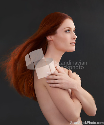 Image of Body, redhead and hair with naked woman in studio for beauty, wellness or color, shampoo or results on black background. Haircare, ginger or model with growth, pride or glowing skin cosmetics