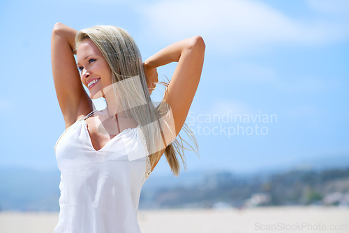 Image of Woman, fashion and smile at beach in summer outfit for hot weather on holiday, break and rest in Miami. Female person, smile and satisfied on leisure or vacation to relax, chill and arms in head