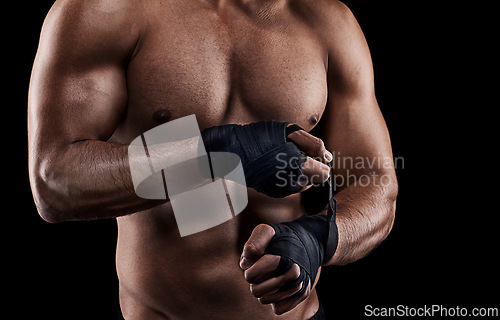 Image of Boxing, person or hand wrap in studio with getting ready to fight, exercise or training on mockup space. Athlete, boxer or martial arts workout for competition, closeup or topless on black background