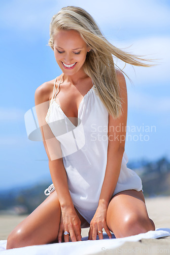 Image of Beach, smile and woman on towel with thinking for summer travel, vacation and relax with happiness. Nature, holiday and German person at seaside for weekend getaway, sun tan and tourism in Bali