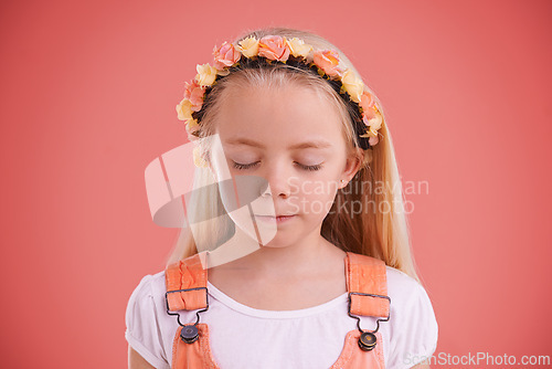 Image of Fashion, flower crown and girl child in studio with casual, trendy and cute outfit with calm face. Peace, stylish and young kid model with cool style and floral headband isolated by pink background.