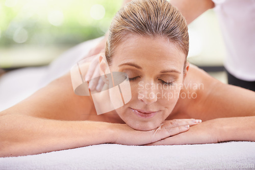 Image of Woman, hands and spa with massage therapist for calm peace for stress relief at zen resort, holiday or vacation. Female person, eyes closed and comfortable for healthy skincare, treatment or luxury