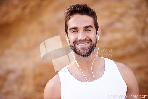 Image of Fitness, headphones and portrait of man with smile for exercise, training and music for workout. Male person, earphones and face with happiness for audio, streaming or podcast for morning cardio