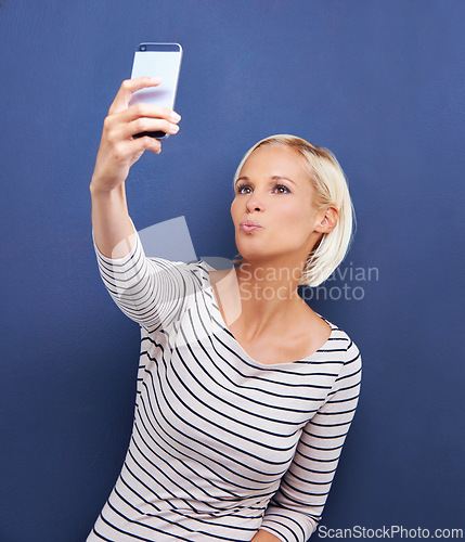 Image of Woman, pout or selfie as digital, memory or social media in viral, update or post on internet app. Confident, proud or influencer in fun, creative or online vision of connectivity on blue background