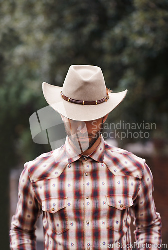 Image of Cowboy, hat and man for fashion, farmer and clothes for western and ranch in Texas for rodeo on mockup. Young person and serious with checkered shirt and attractive for culture, style and trend