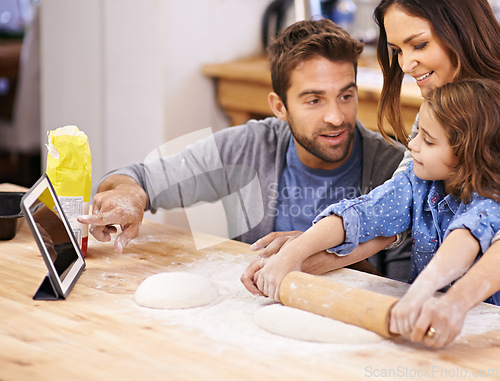 Image of Learning, cooking and family in kitchen with tablet for recipe, guide and mom and dad with child in home. Baking, pizza and parents helping girl with rolling pin and talking about dinner meal prep