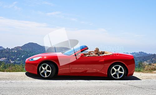 Image of Woman, red convertible and road trip on mountain, travel and luxury transport on summer drive. Happy female person, holiday and countryside wellness on street, vacation and adventure in vehicle