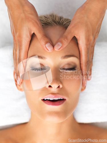 Image of Closeup, beauty or treatment as head, massage or luxury in spa, therapy or mental heath as self care. Woman, hand or relax on zen, retreat or chakra in peace, clinic or balance of cosmetology breath