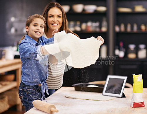 Image of Portrait, mother or child baking pizza in a kitchen teaching recipe for help, support or learning in home. Kid, tablet or girl cooking with parent, family and mom for dinner, supper or lunch together