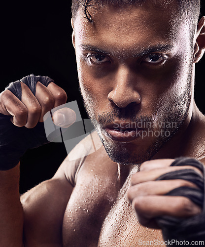 Image of Fitness, portrait and man boxer in studio for power, resilience and training on black background. Fighter, hands by face of sweaty kickboxing male at gym for wellness, exercise or energy workout