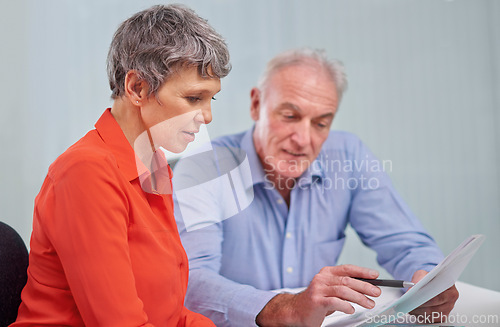 Image of Documents, planning and senior woman with financial advisor in discussion for pension fund in office. Conversation, paperwork and elderly female person with finance consultant for retirement savings.