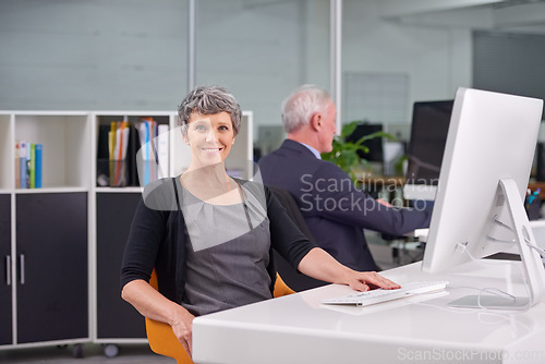 Image of Woman, computer and portrait in office for online, career and profession for research and corporate. Mature person or HR manager and happy with tech for recruitment, website and business for work