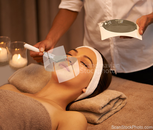 Image of Woman, skincare and application of face mask by beautician for detox, smooth skin and dermatology. Esthetician, client and beauty product at luxury spa for collagen, natural facial and cosmetics