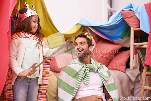 Image of King, play or dad with princess in home in a bedroom fort with crown costume, girl or parent. Family castle, happiness or smile with a knight, father or an excited child in a dress up or sword game